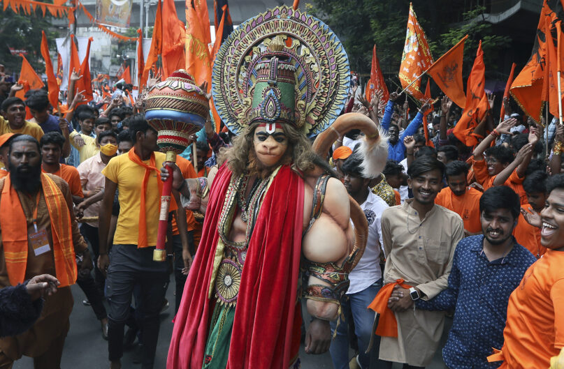 A man dressed as Hanuman walks in a religious procession to mark Hanuman Jayanti, a festival celebrating the birth of the monkey-god Hanuman, in Hyderabad, India, April 16, 2022. Hanuman is one of the most popular gods in the crowded pantheon of Hindu deities, and devout Hindus ascribe great strength and valor to him. (AP Photo/Mahesh Kumar A.)