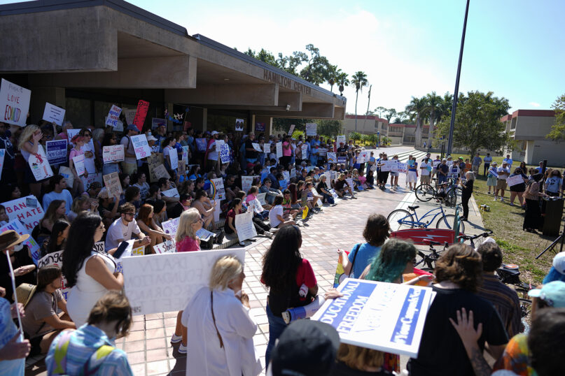 New College of Florida students and supporters protest ahead of a meeting by the college’s board of trustees, Feb. 28, 2023, in Sarasota, Florida. The conservative-dominated board of trustees of Florida’s public honors college was meeting that day to take up a measure making wholesale changes in the school’s diversity, equity and inclusion programs and offices. (AP Photo/Rebecca Blackwell)