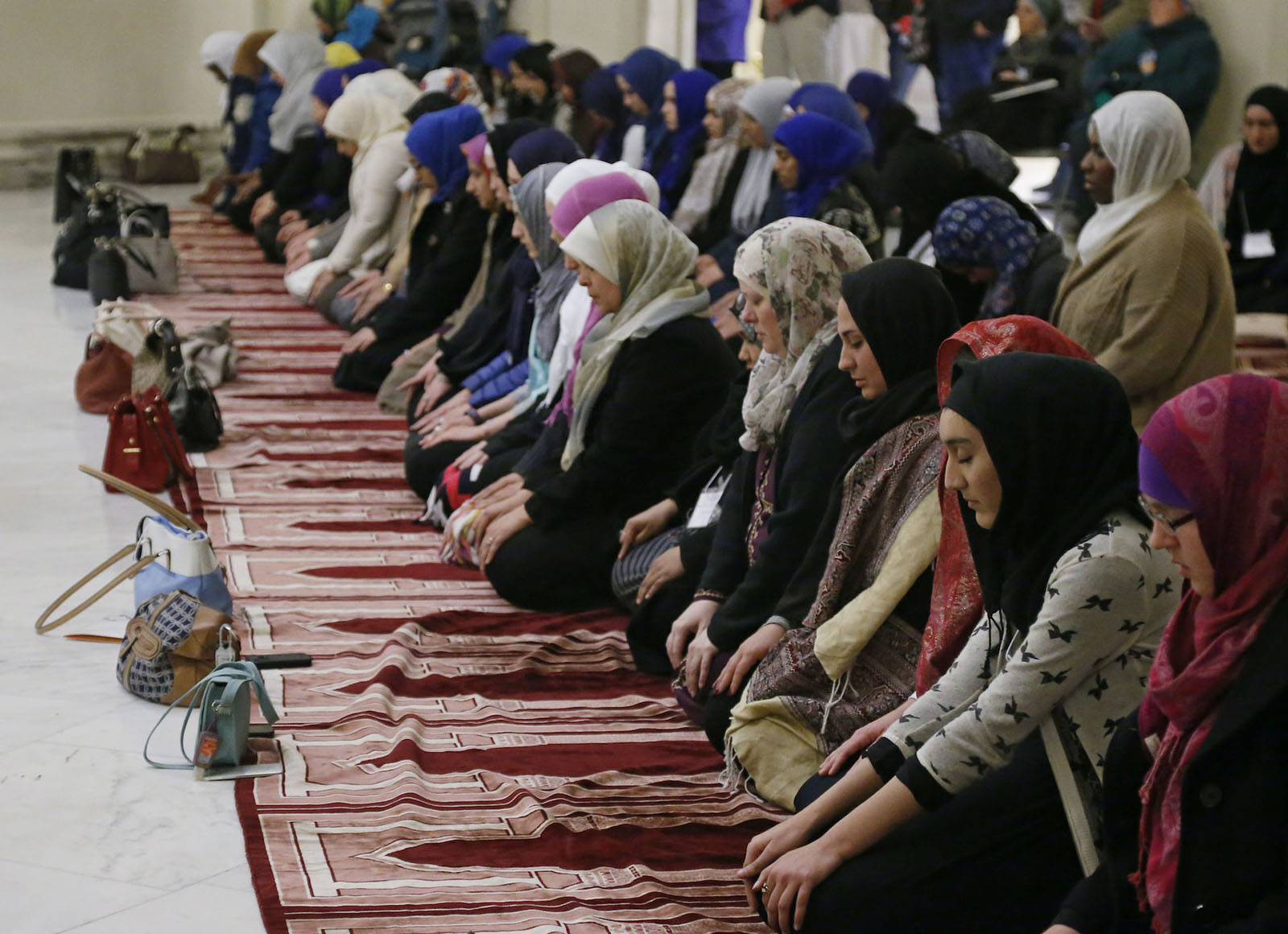 Prayer carpets in mosques have a row of arches. (AP Photo/Sue Ogrocki)