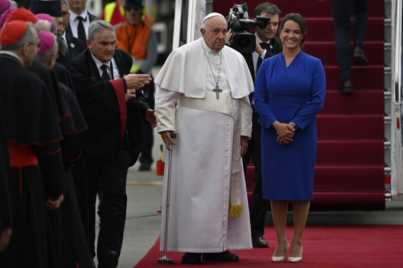 Pope Francis is greeted by Hungary President Katalin Novak during the farewell ceremony at the Budapest International Airport in Budapest, Hungary, Sunday, April 30, 2023. (AP Photo/Denes Erdos)