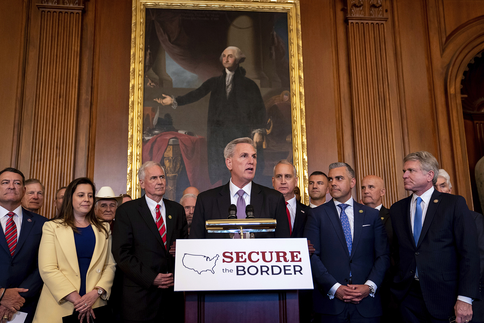 House Speaker Kevin McCarthy, of Calif., center, speaks during a news conference following a vote on H.R. 2, a bill to build more U.S.-Mexico border wall and impose new restrictions on asylum seekers, in the Rayburn Room at the Capitol Building in Washington, Thursday, May 11, 2023. Democrats, who have a narrow hold on the Senate, have decried the aggressive measures in the bill as “cruel” and “anti-immigrant," and President Joe Biden has already promised he would veto it. (AP Photo/Nathan Howard)