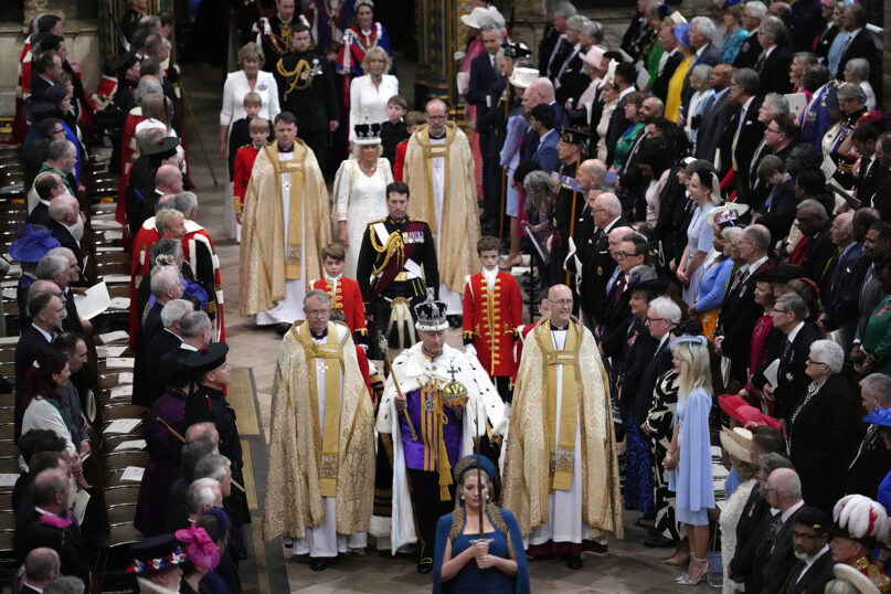 Britain’s King Charles III, front center, and Queen Camilla, middle center, walk in the Coronation Procession after the coronation ceremony at Westminster Abbey in London, May 6, 2023. (AP Photo/Kirsty Wigglesworth, Pool)