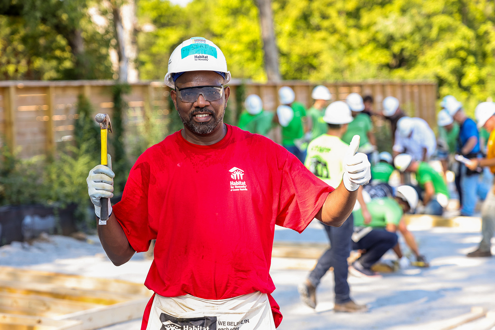 Mustafa, a future Habitat for Humanity homeowner, poses while working on a project in the Nasvhille area in August 2022. Photo courtesy of Habitat for Humanity of Greater Nashville