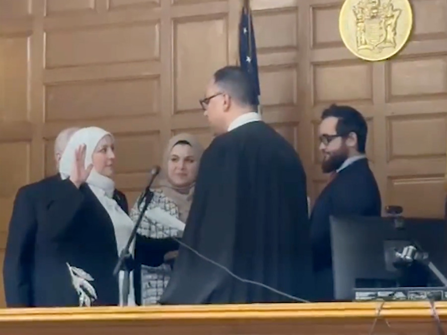 Nadia Kahf, left, takes an oath on Tuesday, March 21, 2023, in New Jersey. Video screen grab