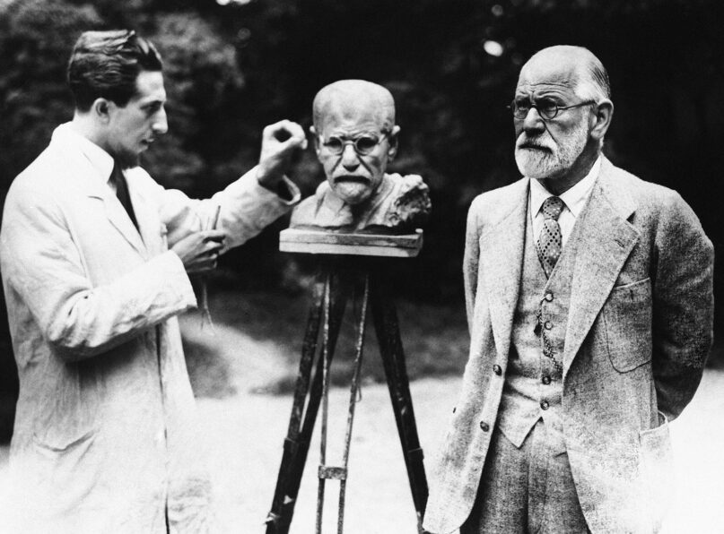 This is a 1931 file photo of Sigmund Freud, right, father of psychoanalysis, as he poses for sculptor Oscar Nemon in Vienna. (AP Photo/File)