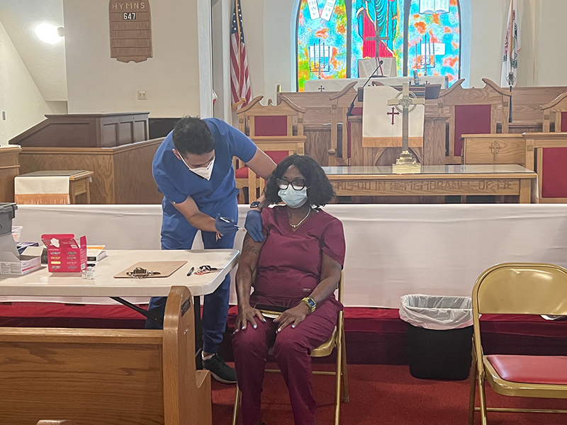 A woman receives a vaccine at Bethel African Methodist Episcopal Church in Ardmore, Pennsylvania, in Sept. 2022. Photo courtesy of Carolyn Cavaness