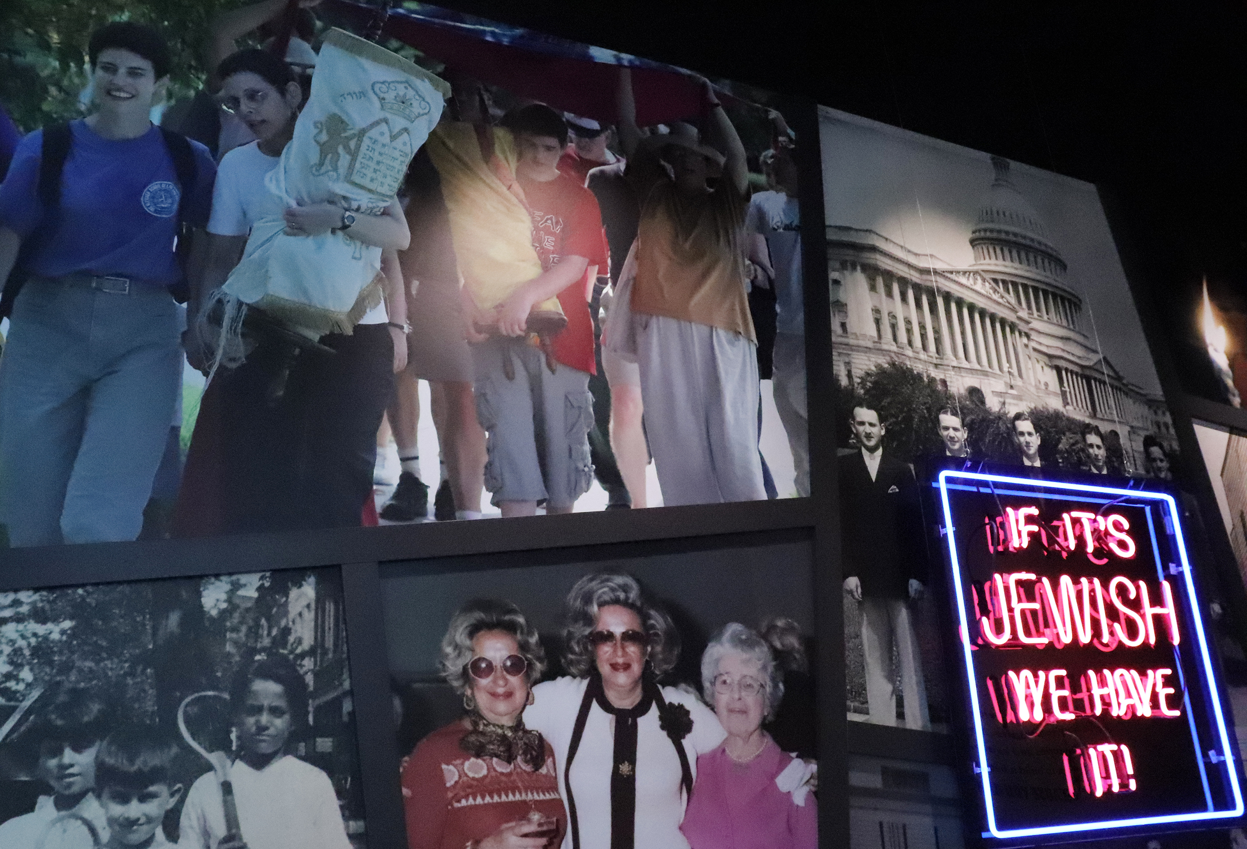 A collage of photographs celebrating members of the Jewish community fill a wall in the Capital Jewish Museum, including an image of members of a Jewish fellowship moving their Torah scrolls on June 1, 2023. RNS photo by Adelle M. Banks