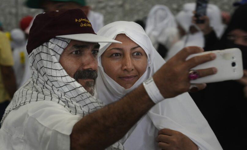 Iranian pilgrims pose for a selfie during the hajj pilgrimage in 2022. (AP Photo/Amr Nabil)