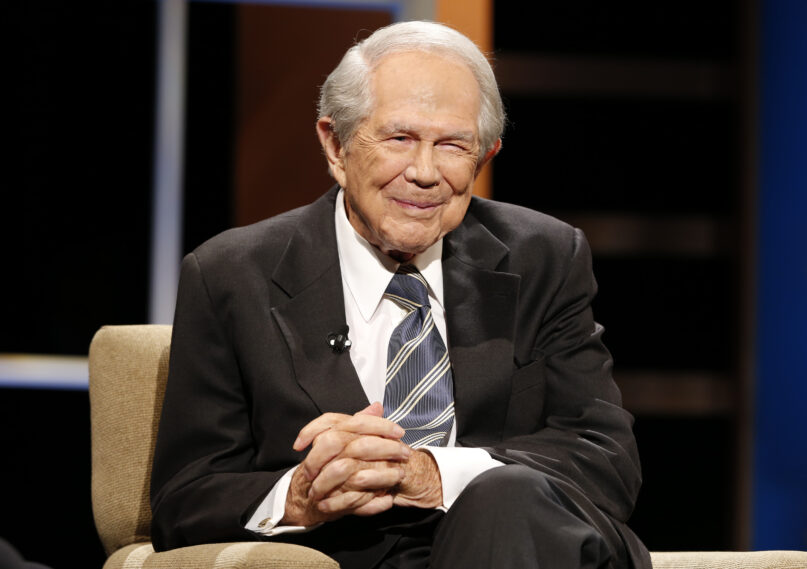 FILE - Rev. Pat Robertson poses a question to a Republican presidential candidate during a forum at Regent University in Virginia Beach, Va., Oct. 23, 2015. Robertson, a religious broadcaster who turned a tiny Virginia station into the global Christian Broadcasting Network, tried a run for president and helped make religion central to Republican Party politics in America through his Christian Coalition, has died. He was 93. Robertson's death Thursday, June 8, 2023 was announced by his broadcasting network. (AP Photo/Steve Helber, File)