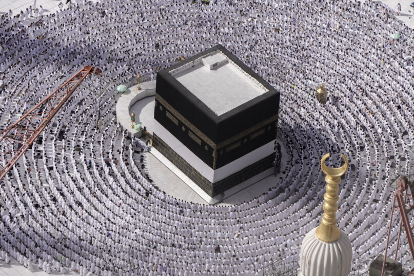Muslim pilgrims pray around the Kaaba, the cubic building at the Grand Mosque, during the annual Hajj pilgrimage in Mecca, Saudi Arabia, June 25, 2023. Muslim pilgrims are converging on Saudi Arabia’s holy city of Mecca for the largest Hajj since the coronavirus pandemic severely curtailed access to one of the Five Pillars of the faith. (AP Photo/Amr Nabil)