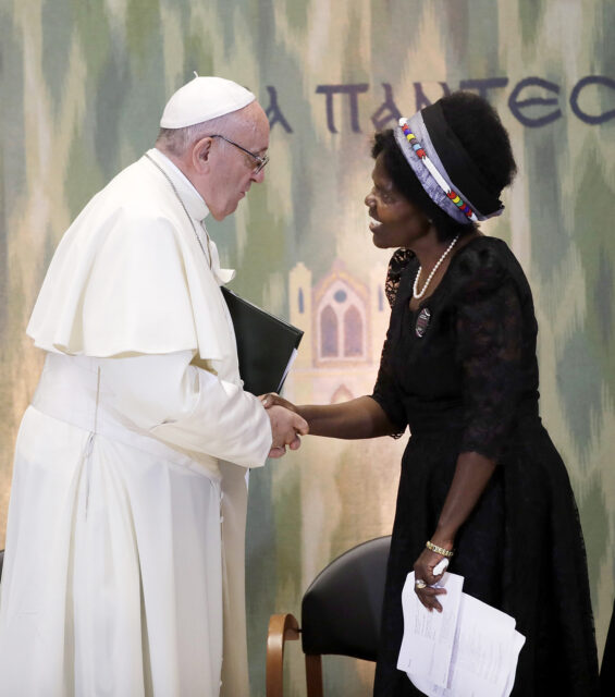 Pope Francis greets Agnes Regina Murei Abuom, moderator of the Central Committee of the World Council of Churches upon his arrival at the Visser't Hall at an ecumenical center in Geneva, Switzerland, Thursday, June 21, 2018. The one-day visit is part of celebrations marking the 70th anniversary of the WCC. (AP Photo/Alessandra Tarantino)