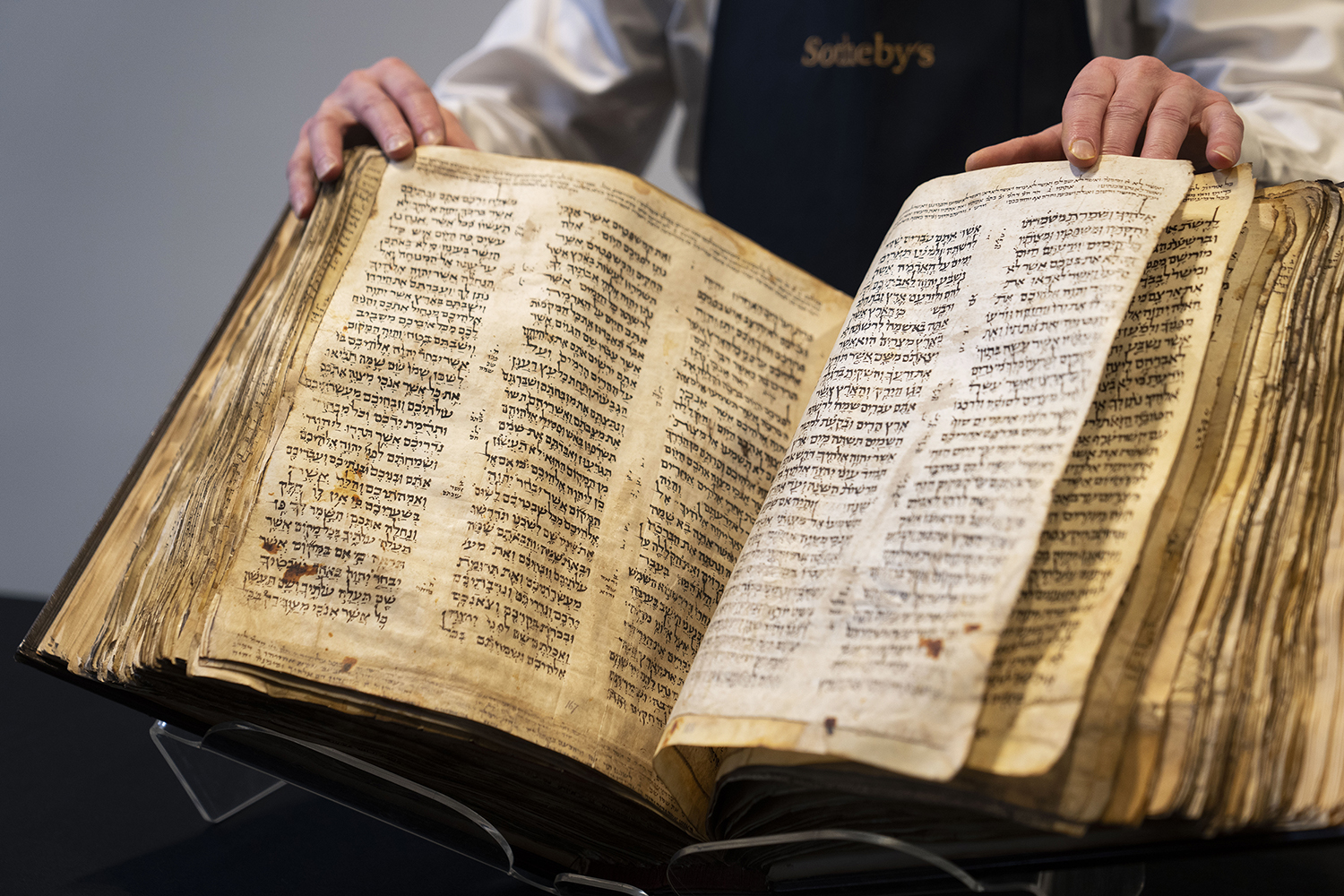 Sotheby's unveils the Codex Sassoon for auction, Wednesday, Feb. 15, 2023, in the Manhattan borough of New York. The auction house is billing the lot as the "earliest, most complete Hebrew Bible ever discovered." (AP Photo/John Minchillo)