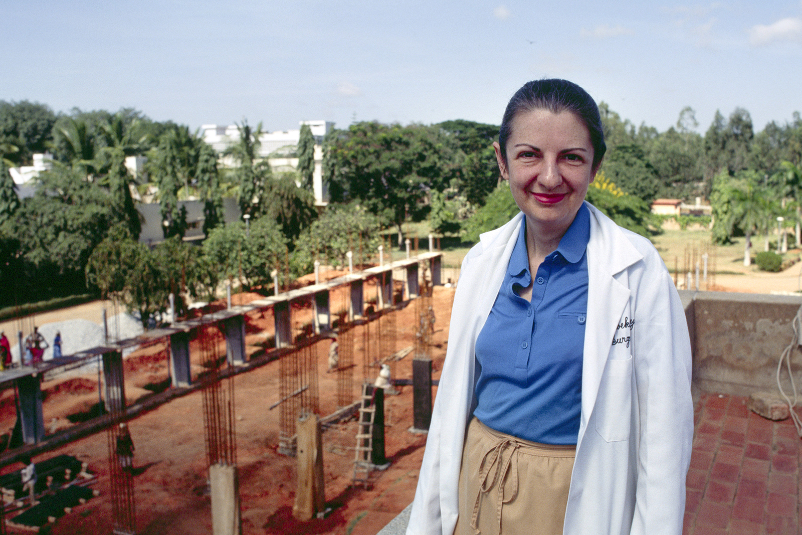 Dr. Rebekah Naylor stands in front of part of Bangalore Baptist Hospital’s expansion construction project in Bangalore, India, in 1990. This expansion of the hospital provided 23 new hospital beds. (© IMB Archive Photo, 1990)