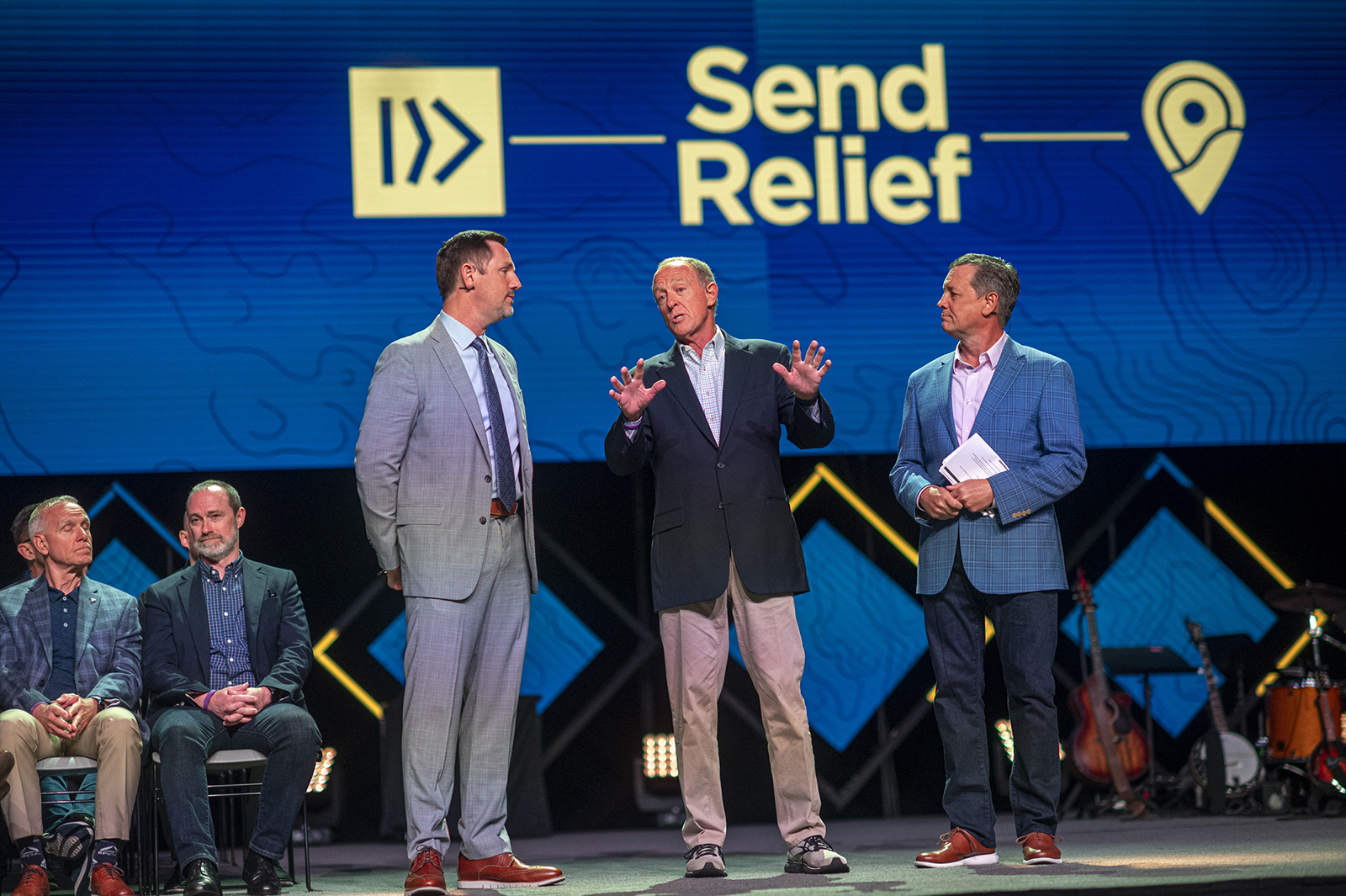 Paul Chitwood, from left, president of the International Mission Board, Bryant Wright, president of Send Relief, and Kevin Ezell, president of the North American Mission Board, at the Southern Baptist Convention annual meeting at the Ernst Memorial Convention Center in New Orleans, La., on June 13, 2023. RNS photo by Emily Kask