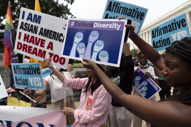 People demonstrate outside of the Supreme Court in Washington, Thursday, June 29, 2023, after the Supreme Court struck down affirmative action in college admissions, saying race cannot be a factor. (AP Photo/Jose Luis Magana)