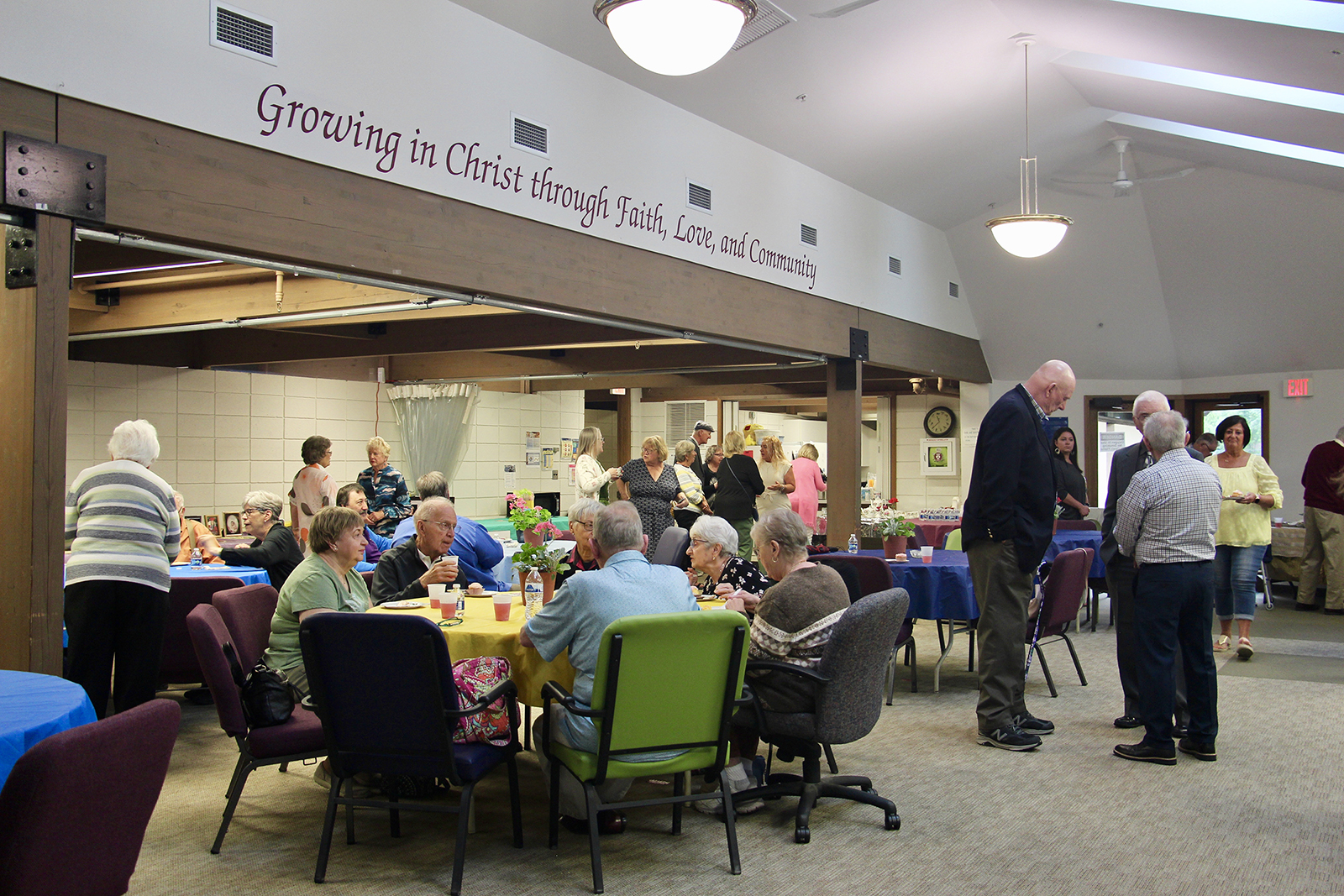 People celebrate two members' 60th wedding anniversary in the fellowship hall, Sunday, June 11, 2023, after a service at Christ United Methodist Church in Greenfield, Wisconsin. RNS photo by Emily McFarlan Miller