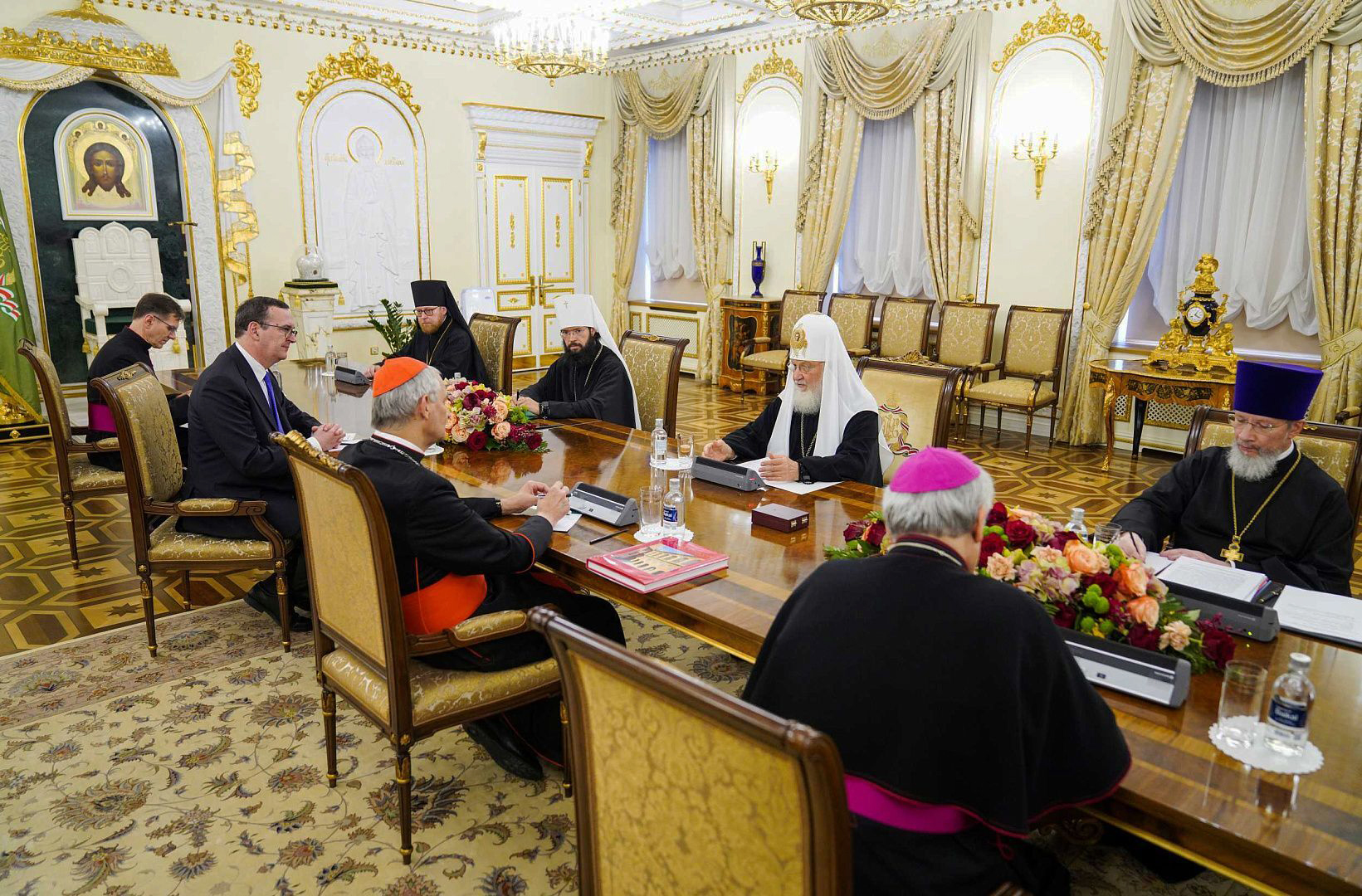 Russian Orthodox clergy and Patriarch Kirill, right side of table, meet with Cardinal Matteo Zuppi and Roman Catholic delegates at the patriarchal residence in Danilov Monastery, in Moscow, Russia, Thursday, June 29, 2023. Photo by Moscow Patriarchate