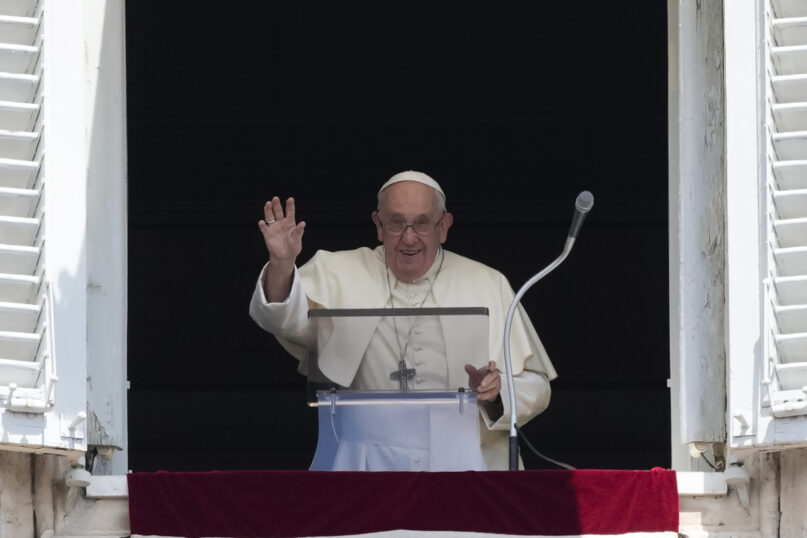 Pope Francis waves as he arrives for the Angelus noon prayer from the window of his studio overlooking St.Peter's Square, at the Vatican, Sunday, July 2, 2023. (AP Photo/Alessandra Tarantino)