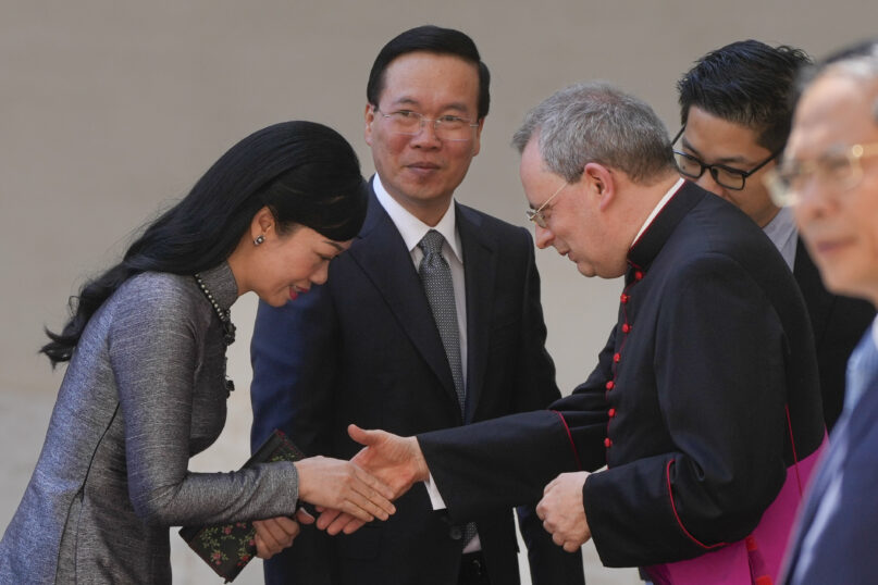Vietnam President Vo Van Thuong arrives with his wife Pham Thi Thanh Tam in the San Damaso Courtyard to meet with Pope Francis at the Vatican, Thursday, July 27, 2023. (AP Photo/Gregorio Borgia)