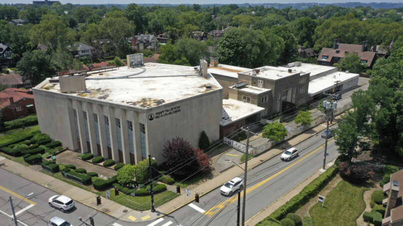 This photo taken with a drone shows the Tree of Life Synagogue, left, in the Squirrel Hill neighborhood of Pittsburgh on July 13, 2023, the day a federal jury announced it had found Robert Bowers, who in 2018 killed 11 people at the synagogue, eligible for the death penalty. (AP Photo/Gene J. Puskar)