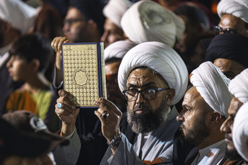 Supporters of the Shiite cleric Muqtada al-Sadr raise copies of the Quran, Muslims' holy book, during a protest in Sadr City, in response to the burning of Quran in Sweden, Baghdad, Iraq, Wednesday, July 12, 2023. (AP Photo/Hadi Mizban)