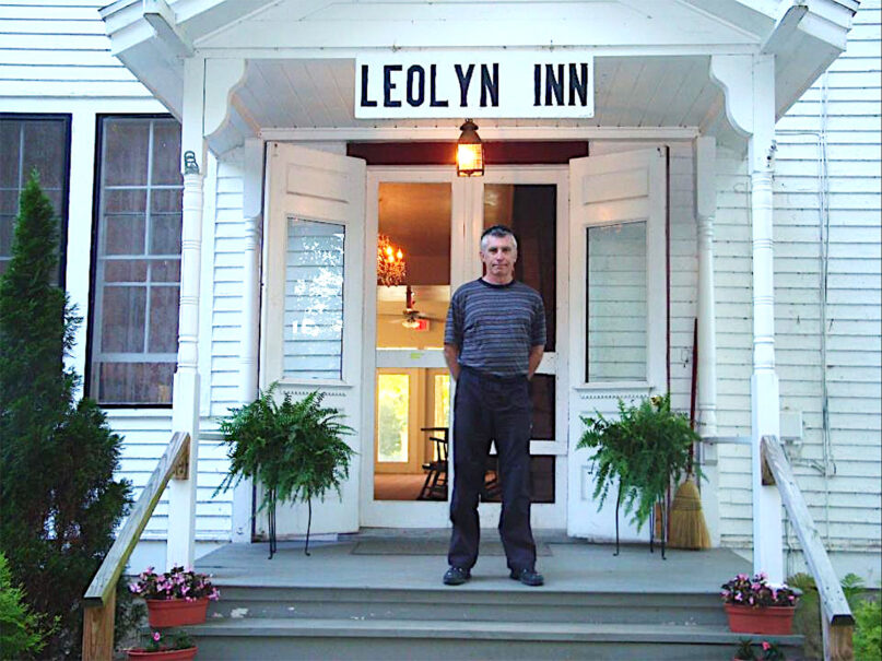 Leonard George in front of a 19th-century hotel in Lily Dale. The place is said to be haunted. Photo courtesy of George
