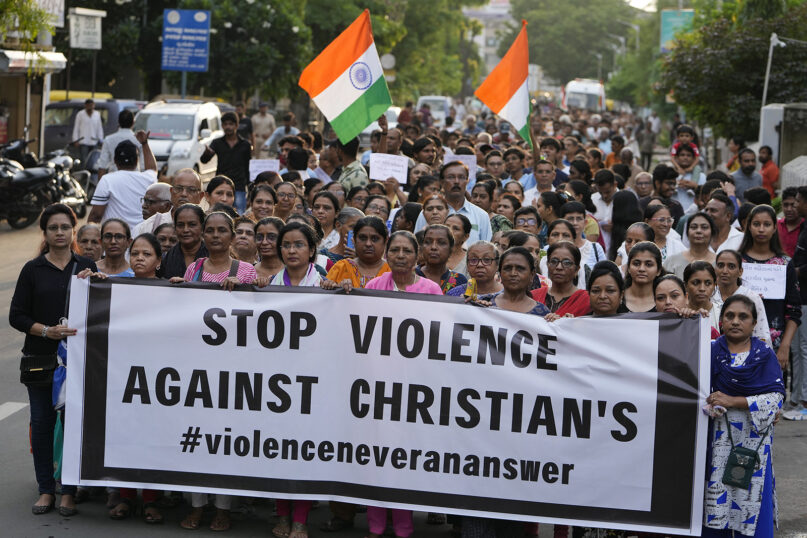 Demonstrators hold a banner during a rally in solidarity with the people of northeastern Manipur state, in Ahmedabad, India, Sunday, July 23, 2023. Protests have erupted across the country after a video showing mob assaults on two women who were paraded naked sparked widespread outrage on social media. More than 130 people have been killed in the northeastern state since violence between two dominant ethnic groups erupted in early May. (AP Photo/Ajit Solanki)