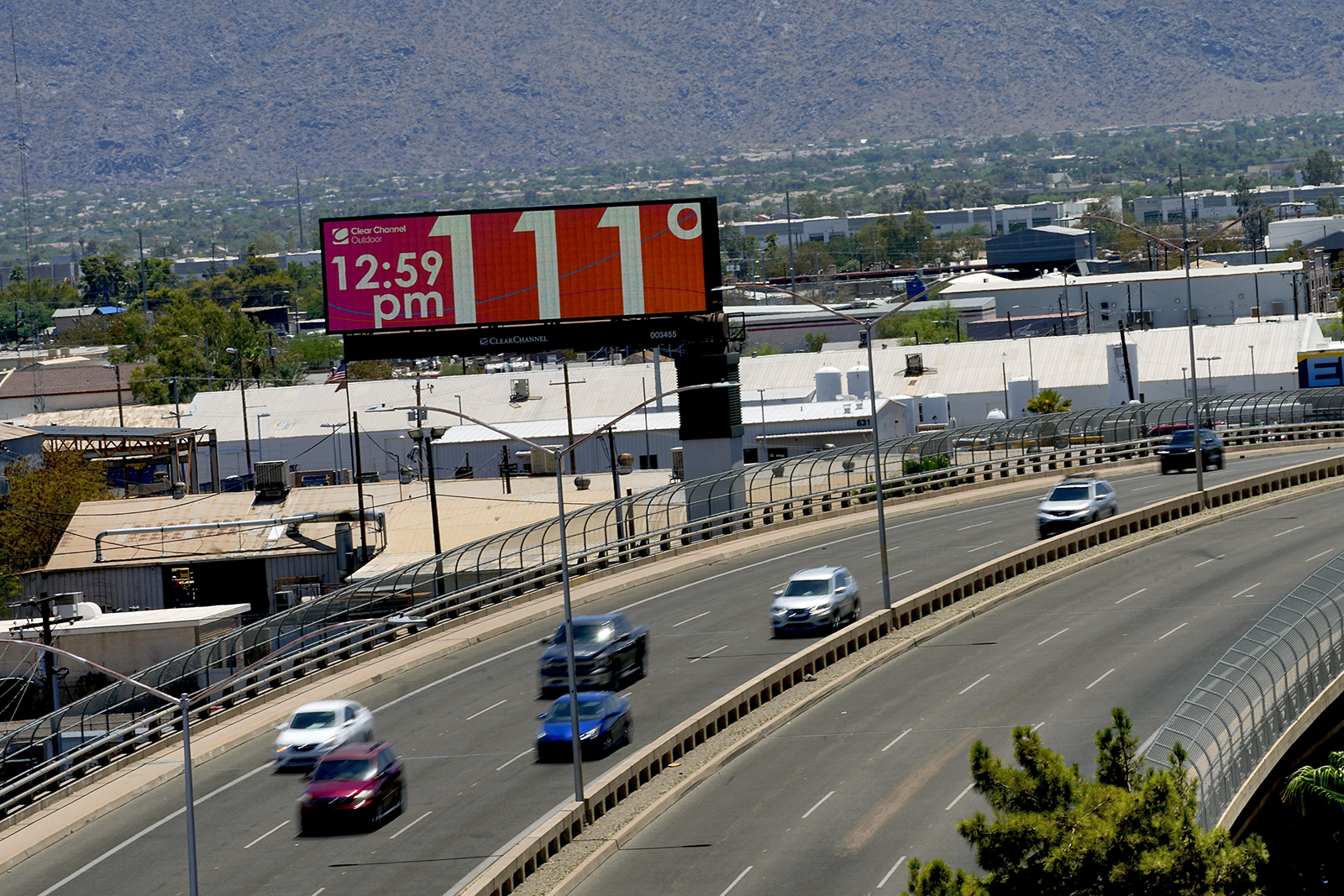 A digital billboard displays an unofficial temperature, July 17, 2023, in downtown Phoenix. Millions of people around the Southwest are living through a historic heat wave. (AP Photo/Matt York, File)