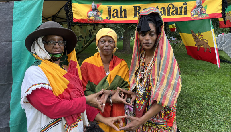 Rastas Patricia Ervin, from left, Althea Parkinson, and Nicole Morgan form a Star of David with their hands at Prospect Park in Brooklyn, New York, Sunday, July 23, 2023. RNS photo by Fiona André
