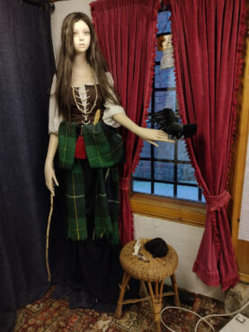 A mannequin holding a crow is part of a series helping understand the early roots of witchcraft in Scotland. Photo by Sukhada Tatke