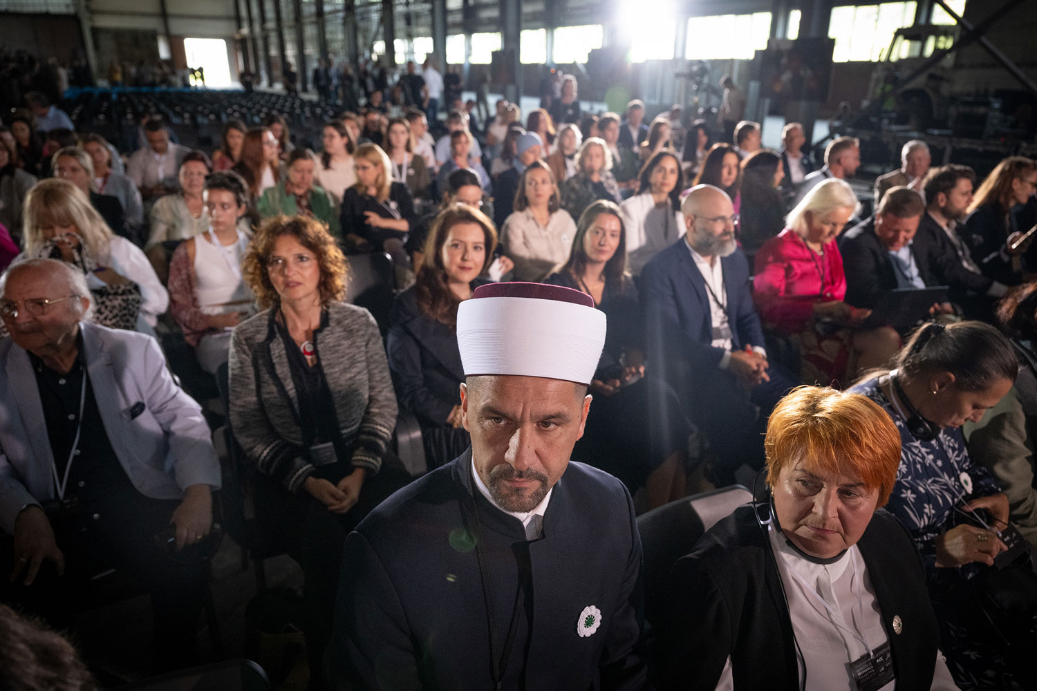 Attendees join together for a presentation during the Srebrenica Genocide Commemoration in early July in Bosnia. Photo by Shahar Azran/WJC