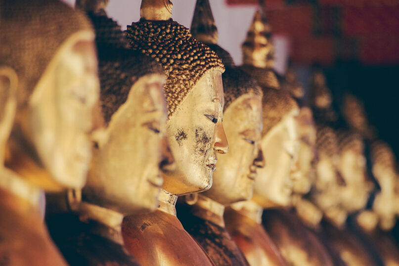 Buddha statues at a Bangkok temple. Photo by Alexandre Chambon/Unsplash/Creative Commons