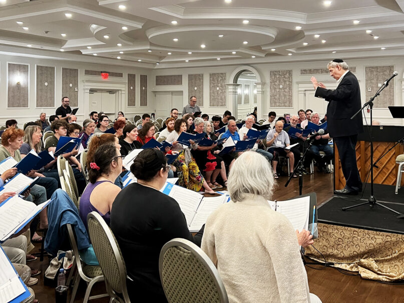 Matthew Lazar, founder of the North American Jewish Choral Festival, leads a rehearsal of his instant ensemble on Wednesday afternoon, July 12, 2023. RNS photo by Kathryn Post