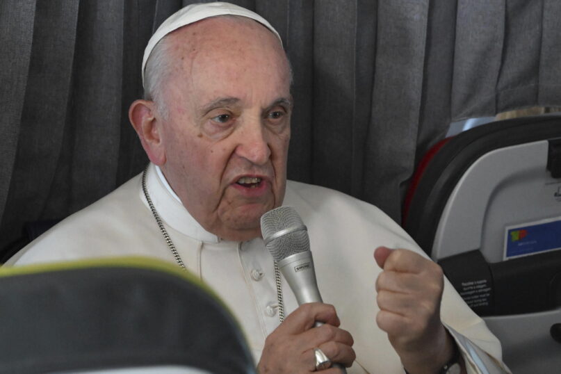 Pope Francis meets the journalists during a press conference aboard the airplane directed to Rome, at the end of the 37th World Youth Day in Lisbon, Sunday, Aug. 6, 2023. (Maurizio Brambatti/Pool Photo Via AP)