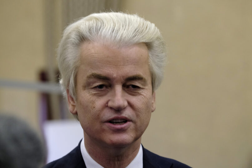 FILE - Dutch lawmaker Geert Wilders answers reporters after casting his vote in a general election in The Hague, Wednesday, March 17, 2021. Dutch prosecutors demanded a 12-year prison sentence Tuesday for a former Pakistani cricketer accused of incitement to murder firebrand anti-Islam lawmaker Geert Wilders. The suspect, identified by Wilders as Khalid Latif, did not appear in a high-security courtroom near Amsterdam's Schiphol Airport for his trial. (AP Photo/Patrick Post, File)