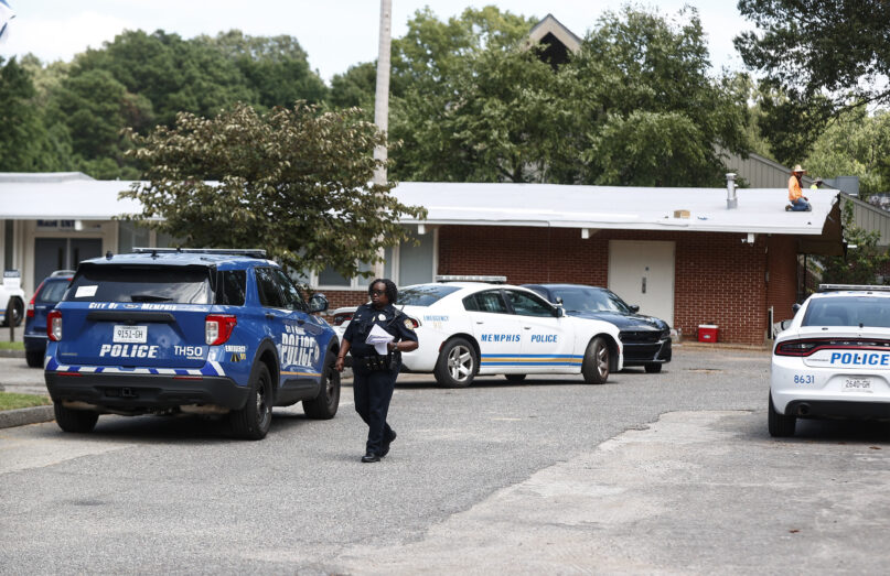 A Memphis Police officer walks on the scene of a shooting at Margolin Hebrew School on Monday, July 31, 2023 in Memphis, Tenn. (Mark Weber/Daily Memphian via AP)