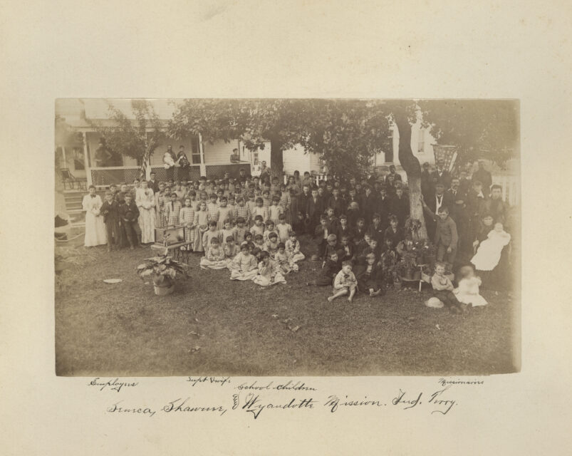 In this photo taken between 1869 and 1895, provided by the Quaker and Special Collections at Haverford College, school children of the Seneca, Shawnee, and Wyandotte Mission Indian Territory, gather for a portrait in Wyandotte, Okla. This image is one of 20,000 archival pages related to boarding schools for Native youths operated by the Quakers that will be digitized by the National Native American Boarding School Healing Coalition. (Quaker and Special Collections, Haverford College via AP)
