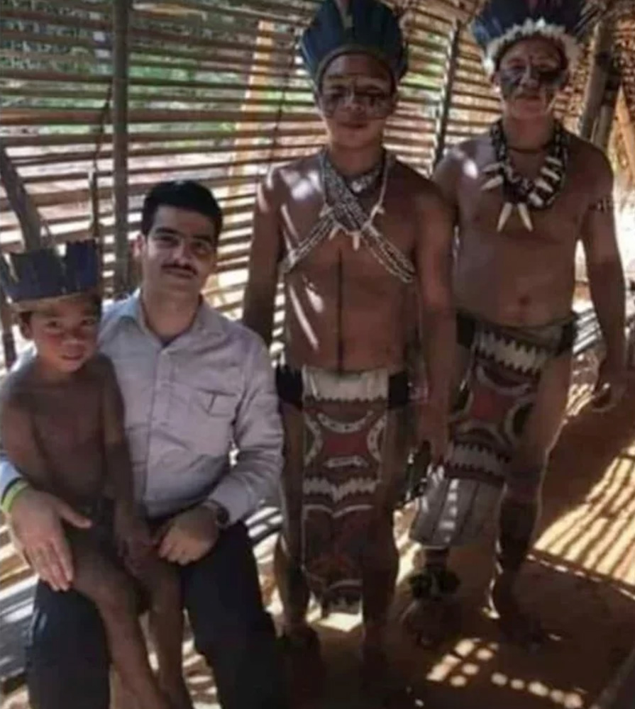 In this photo taken from Facebook and used by a variety of Brazilian media outlets, Abdulhakim Tokdemir, second left, poses with members of the Tuyuka people in 2019, in a village near Manaus, Brazil. Photo via Facebook