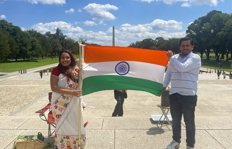 Priya Kothari, left, and her husband, Vaibhav, attend an India Independence Day event on the National Mall in Washington, Aug. 13, 2023. RNS photo by Richa Karmarkar