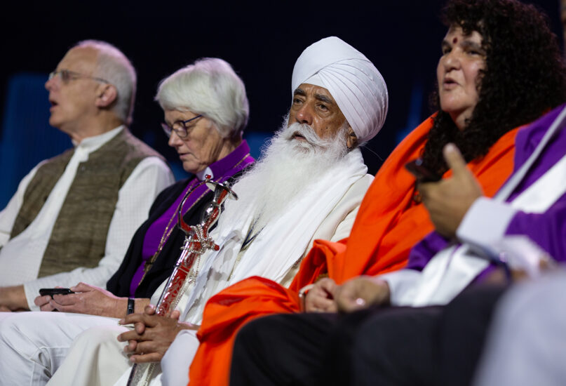 Religious leaders chant on stage during a climate repentance ceremony at the Parliament of the World’s Religions in Chicago on Aug. 15, 2023. Photo by Lauren Pond for RNS