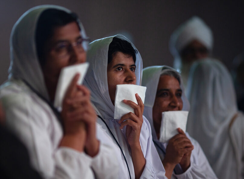 Jain nuns participate in a climate repentance ceremony at the Parliament of the World’s Religions in Chicago on Aug. 15, 2023. Photo by Lauren Pond for RNS