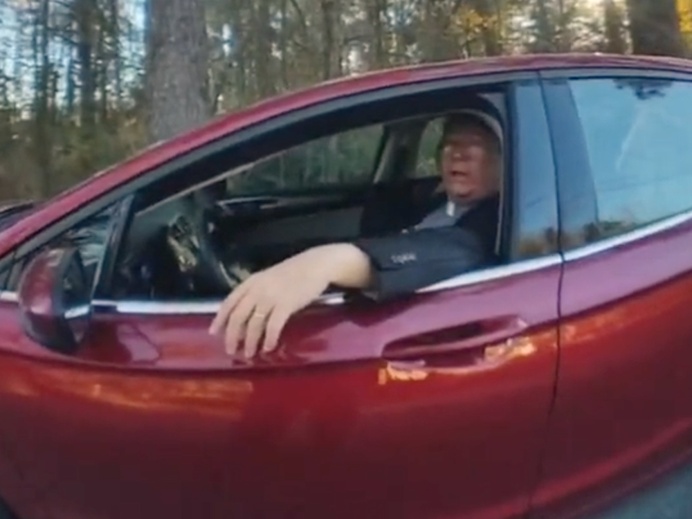 The Rev. Stephen Cliffgard Lee, as seen in police body camera footage, outside the home of election worker Ruby Freeman on Dec. 15, 2020, in Cobb County, Georgia. Video screen grab via Cobb County Police Dept.