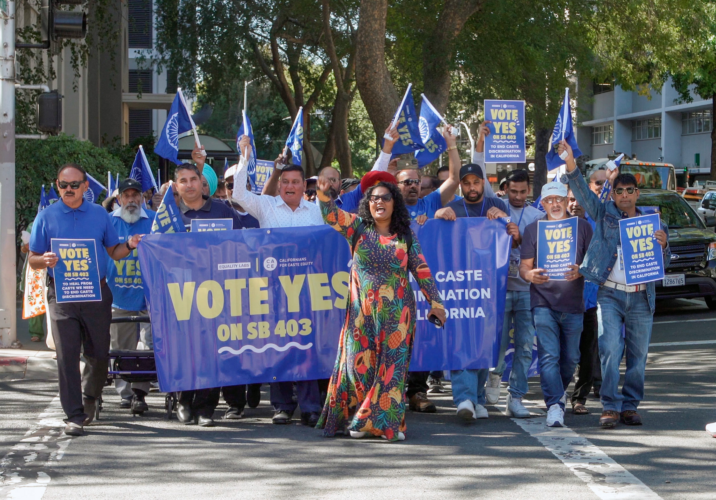 Thenmozhi Soundararajan, center, leads a groups of demonstrators marching in favor of SB 403 in Sacramento, California. Photo courtesy of Equality Labs