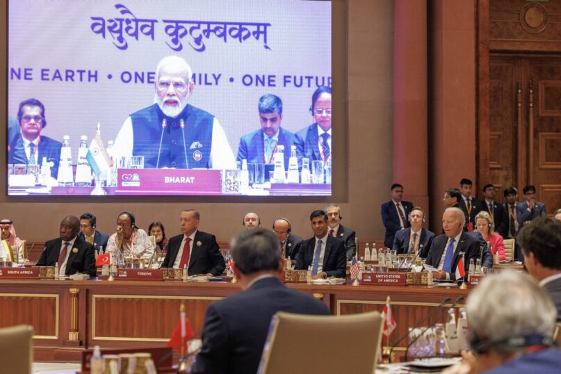 Indian Prime Minister Narendra Modi welcomes delegates to the G20 leaders summit in front of a placard reading 'Bharat,' the Hindi word for 'India.' (Dan Kitwood/Getty Images)