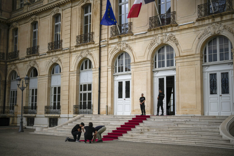 A red carpet is unrolled at the Palais du Pharo prior to Pope Francis' visit in Marseille, southern France, Thursday, Sept. 21, 2023. Ten years after Pope Francis made a landmark visit to the Italian island of Lampedusa to show solidarity with migrants, he is joining Catholic bishops from the Mediterranean this weekend in France to make the call more united. Pope Francis will be in Marseille on Sept. 22 and 23 2023. (AP Photo/Daniel Cole)