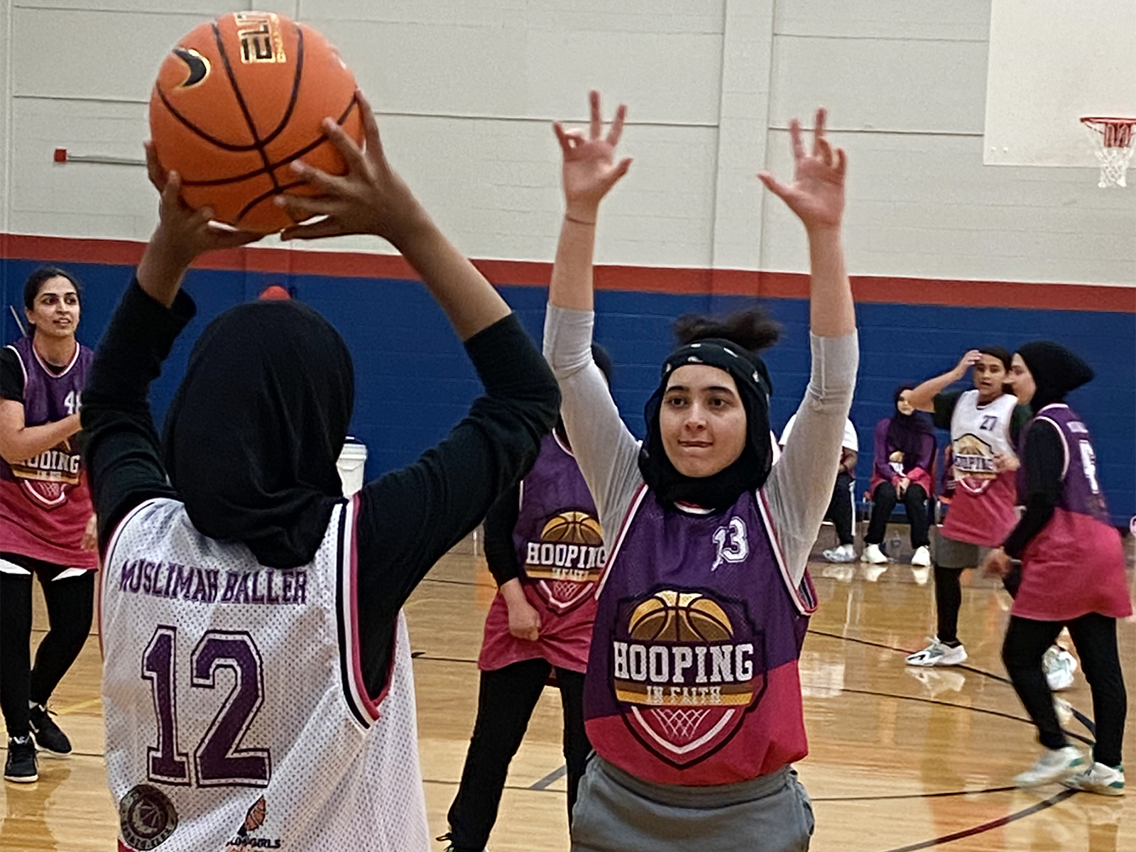Amna Masoud, right, defends during an inbound play at a Hooping in Faith program in July 2023 in Memphis, Tenn. Photo by Liz Kineke