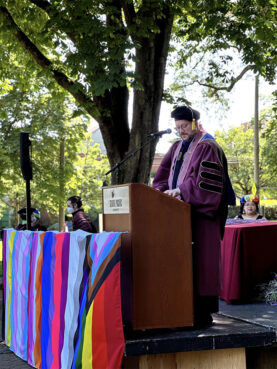 Christopher Hanson speaks during a Lavender Graduation ceremony at Seattle Pacific University. Photo courtesy of Hanson
