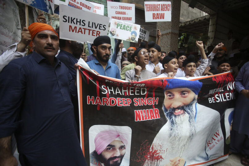 Members of the Sikh community hold a protest against the killing of Hardeep Singh Nijjar, shown on banner, in Peshawar, Pakistan, Wednesday, Sept. 20, 2023. Dozens of Sikhs living in Pakistan rallied against the killing of Nijjar, a 45-year-old Sikh leader who was killed by masked gunmen in Canada in June. (AP Photo/Muhammad Sajjad)