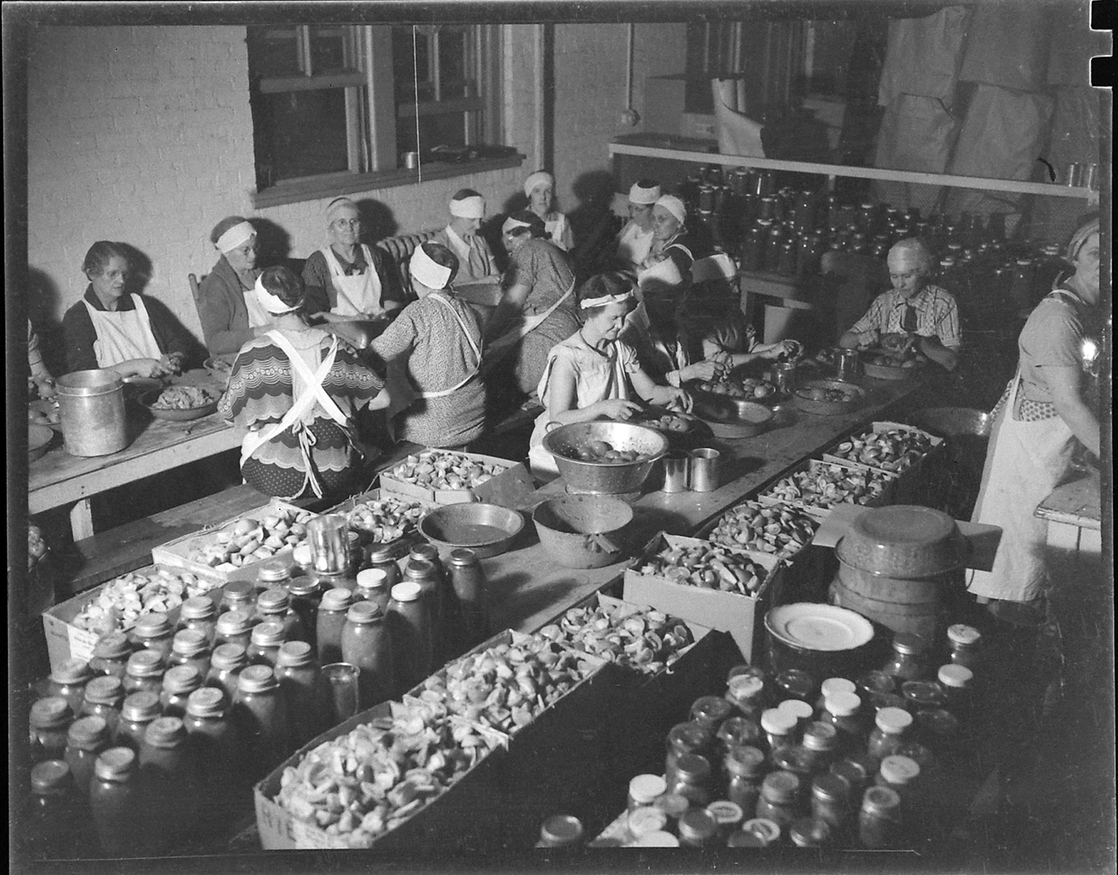 Women with a Mormon charity group prepare foods in Sept. 1937. Photo by Hansel Mieth/The LIFE Picture Collection/Shutterstock