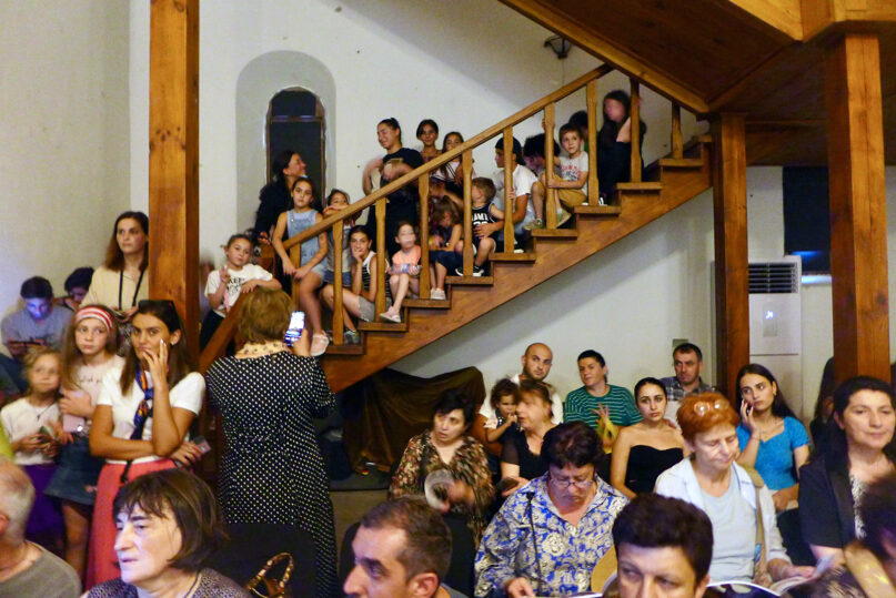 Local children crowd the stairs in the main hall of the Episcopal Palace of the Nikozi Monastery and await the first screening of the Nikozi International Animation Film Festival on Sept. 1, 2023, in Nikozi, Georgia. Photo by Clément Girardot